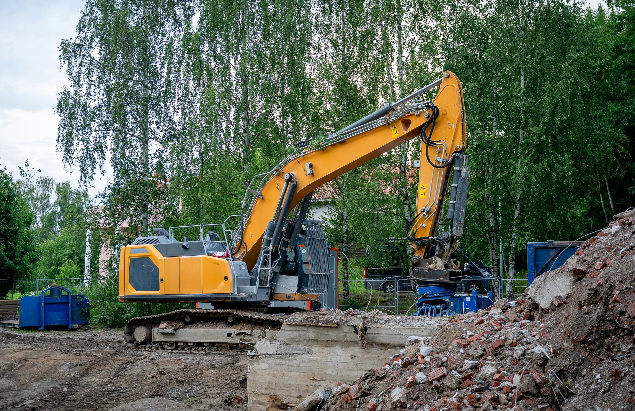 Concrete demolition equipment in action
